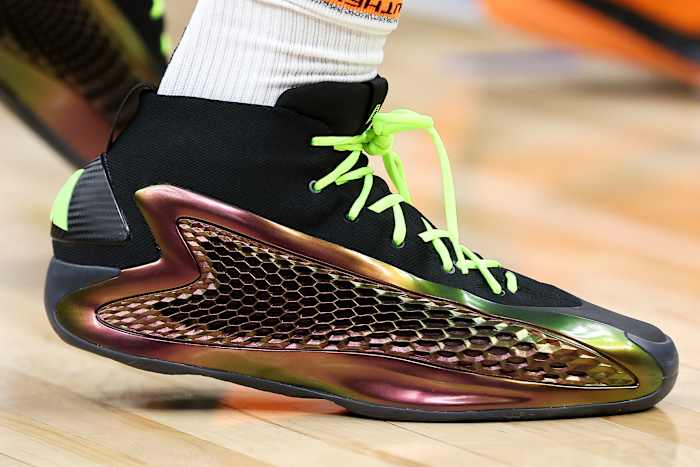 Anthony Edwards' black and green adidas sneakers.